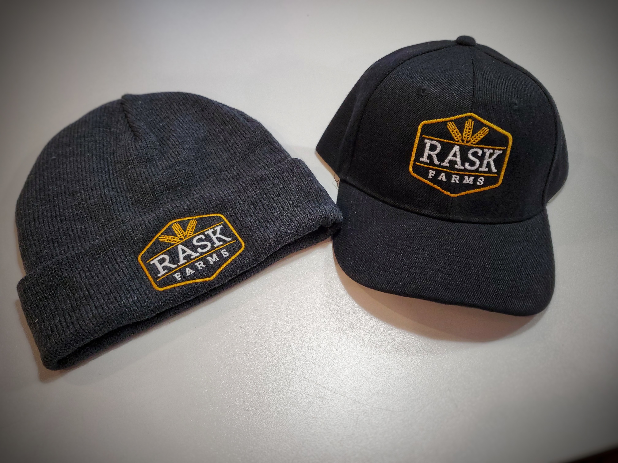 Rask Farms branded hats