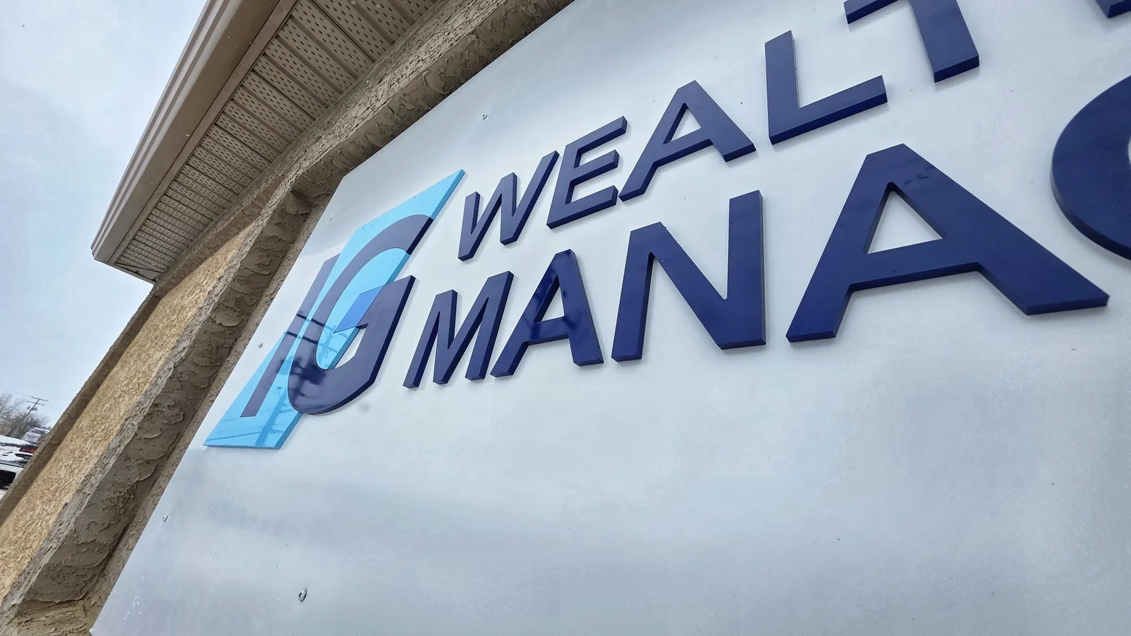 IG Wealth Management exterior storefront sign fabricated and installed by MarkIt Signs in Saskatchewan